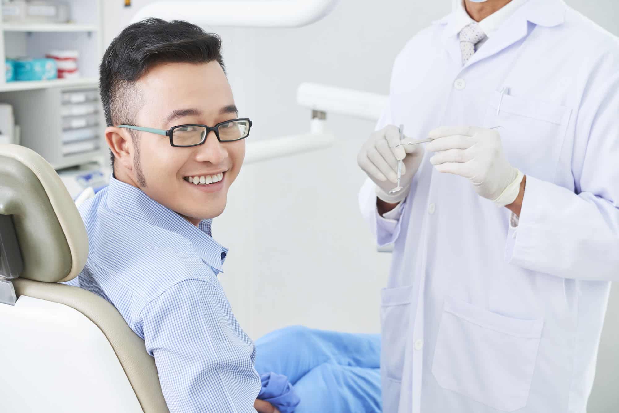 Happy Asian Patient At Dentist's