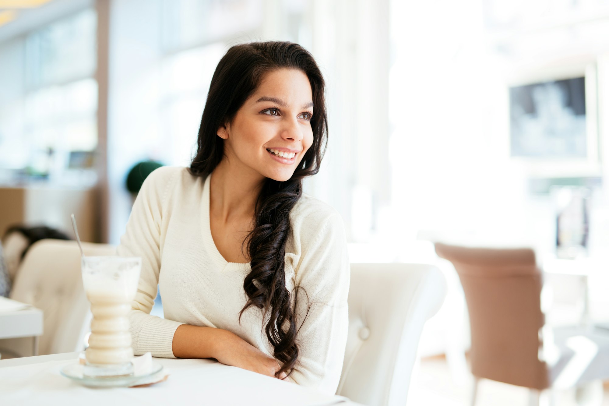 Glamorous lady drinking coffee and smiling happy