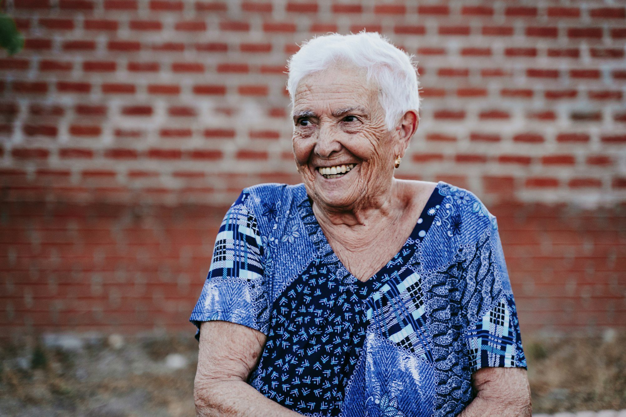 portrait of old lady in her 80s laughing happily