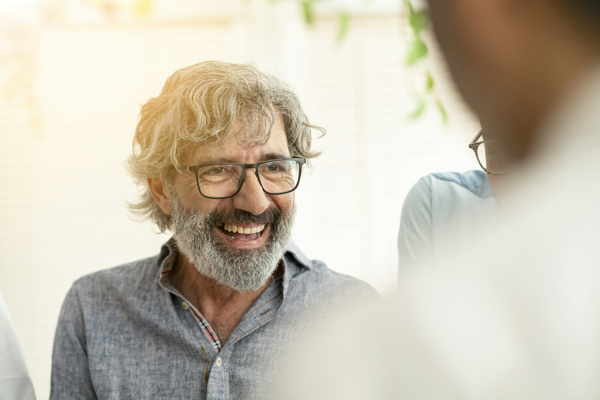 senior businessman smiling with work group